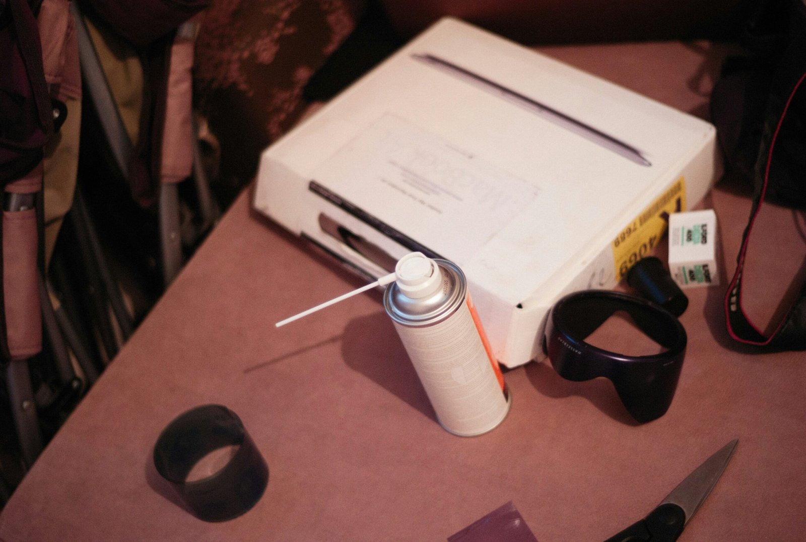 An organized desert survival kit containing water bottles, flashlight, and map