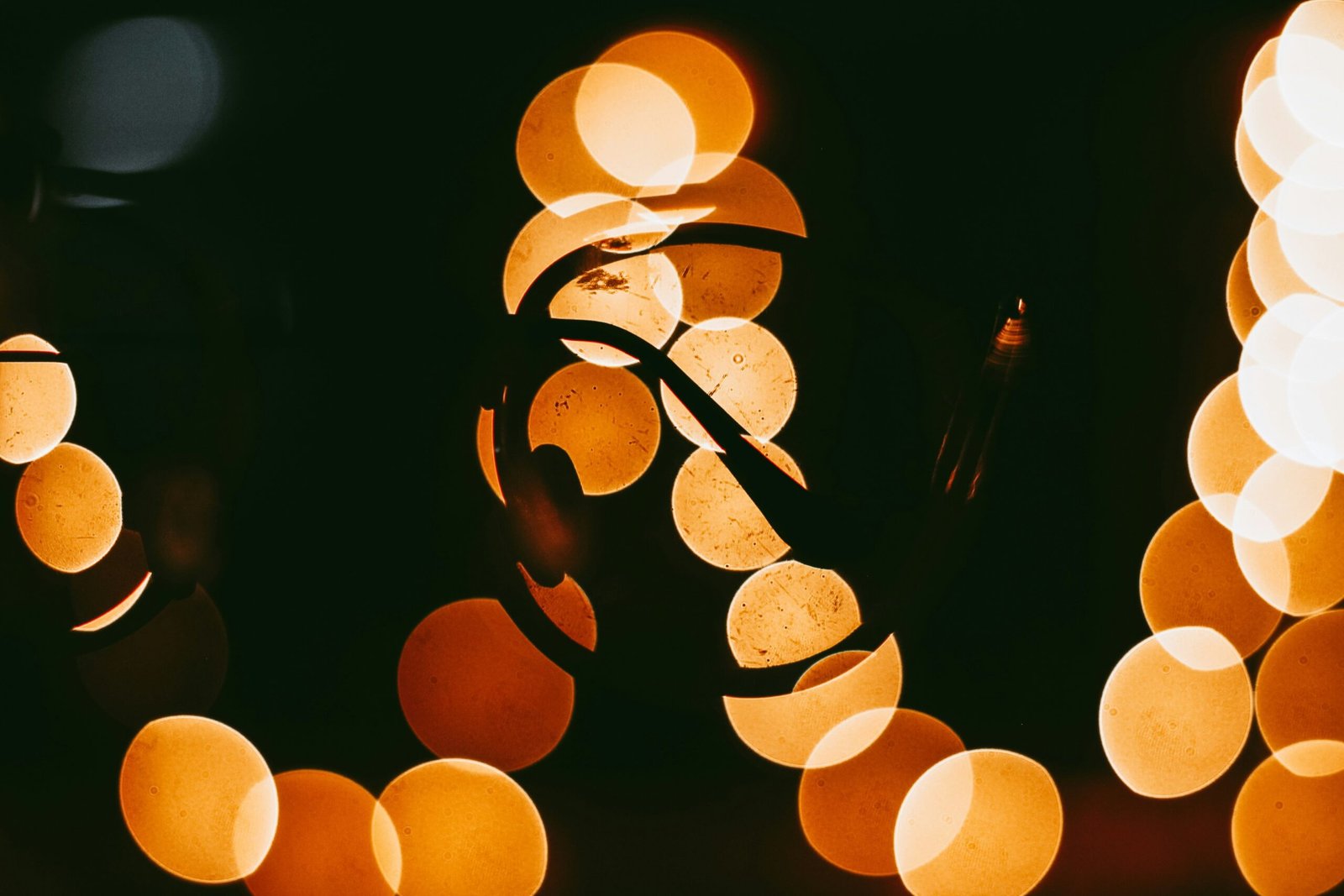 Intricate geometric sand mandala glowing faintly in soft evening light