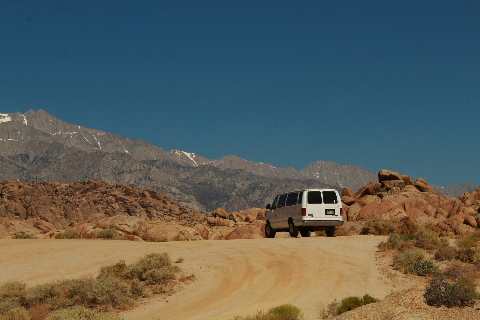 Person inspecting helmet and protective clothing before quad biking