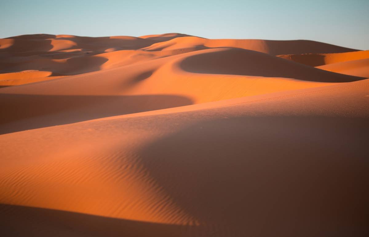 Golden sand dunes stretching endlessly across the horizon